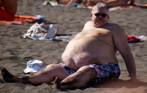 obese man at beach